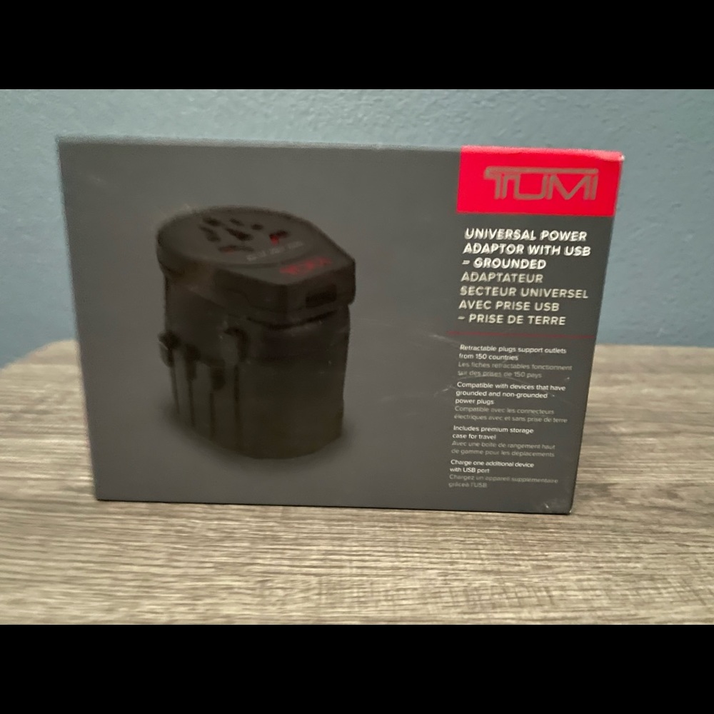 TUMI Universal adapter with case.